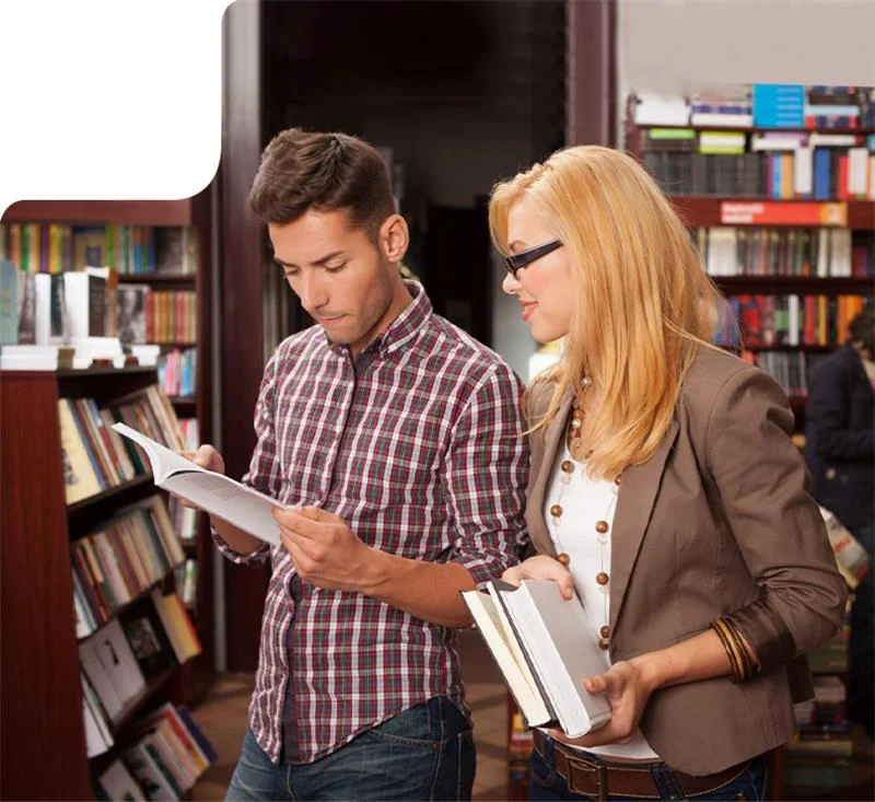 Authors reading books in a library